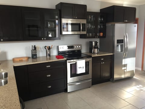 Fully equipped kitchen with brand new stainless appliances and a dishwasher