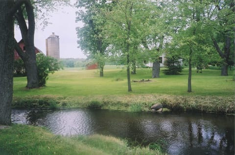 Flowing river runs through the property, which also has a small spring fed lake.