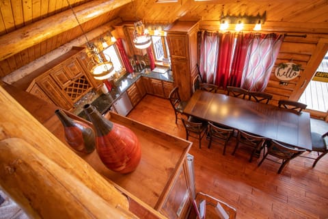 Overhead loft view of kitchen and dining area.