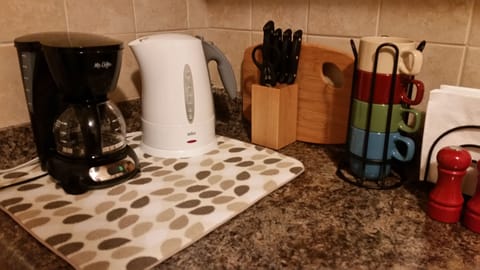 Complimentary tea & coffee supplies, dishes, pots & pans needed to cook a meal.