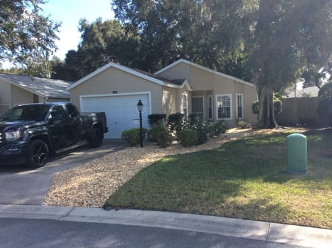 Front entrance, driveway and garden.