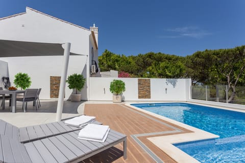 Large patio and heated private pool with kids section