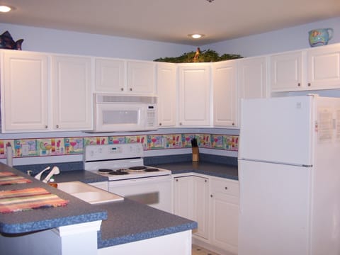 The convenience of a full kitchen makes it easy to prepare meals.