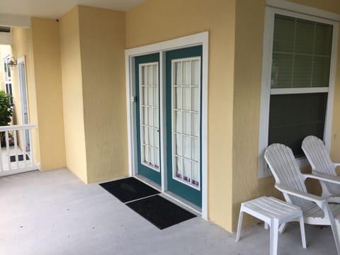 French door side entry leading into living room with additional patio space.