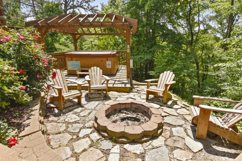Enjoy outdoor fire pit & therapeutic hot tub.