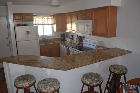 Bar seating & kitchen