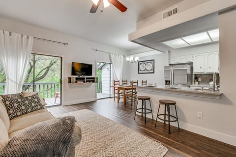 View of relaxing living room. Lots of seating w/ sleeper sofa, and loveseat, bar