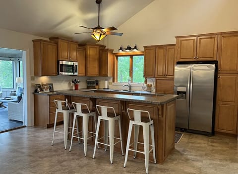 Bright, open kitchen with stainless steel appliances