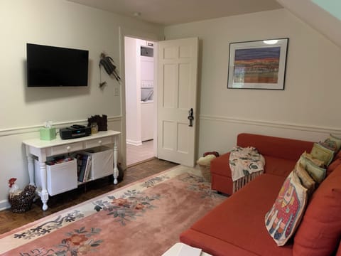 Smart TV with YouTube TV, books, games, and more in the cozy living room. 