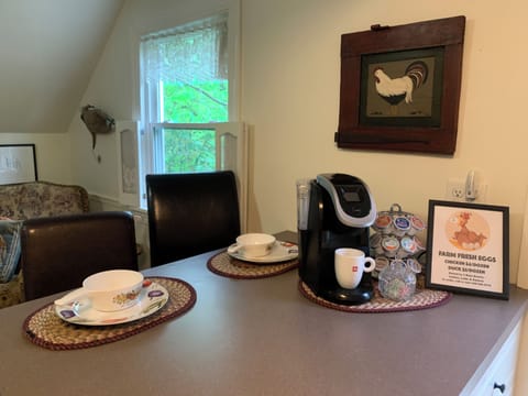 Eat-in kitchen with coffee station. We provide a starter pack of k-cups.