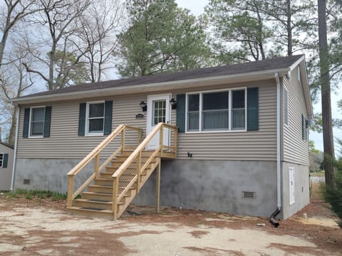 our waterfront property , newly lifted 5 ft