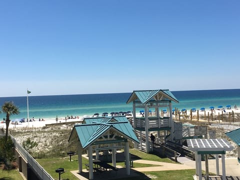 WEST FACING VIEW OF BEACH TAKEN BY ME FROM THE LARGE BALCONY. SEATS 6.
