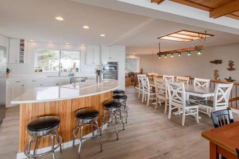 Multiple seating and serving options with the bar and 2 dining tables.