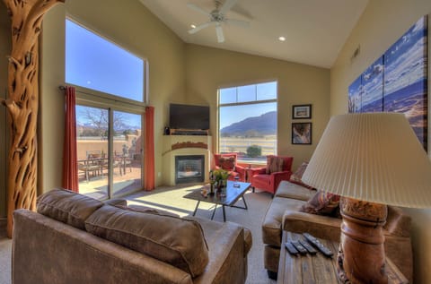 Living room has spectacular views and plenty of comfortable seating
