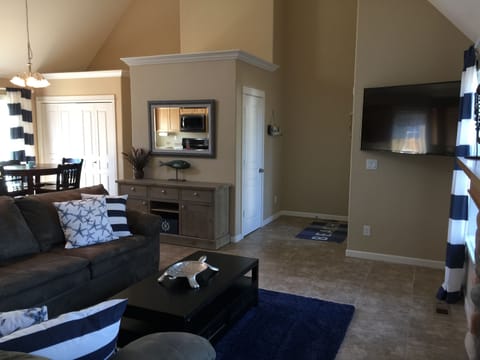 A welcoming front entry & the inviting living area is perfect for a beach trip