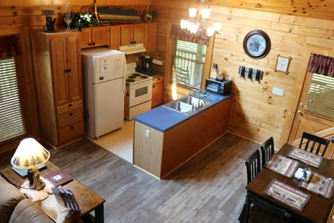 View of kitchen and dining table from loft