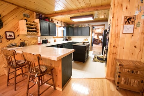 The spacious kitchen is well stocked with everything you might need.