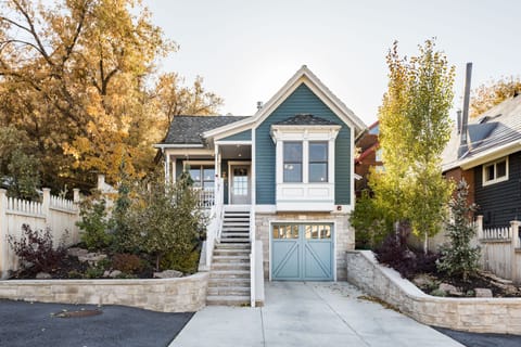 front of house with garage and heated driveway