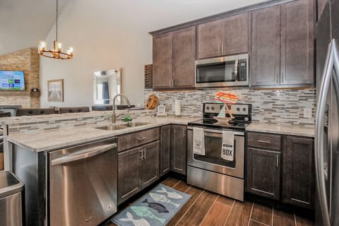 Fully updated, exotic white granite, crown molding, glass splash, stainless appl