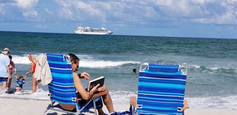 Relaxing at the beach. Primary Photo 