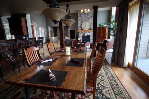 Open floor plan. Handcrafted, live edge dining table seats 10. Counter seats 6.