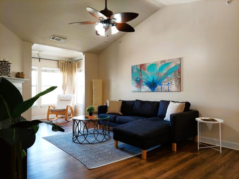 You will walk into a very bright, modern, spacious, and open living room.