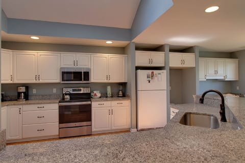 All new appliances, granite countertops w/ bar seating for 4 and eat in kitchen