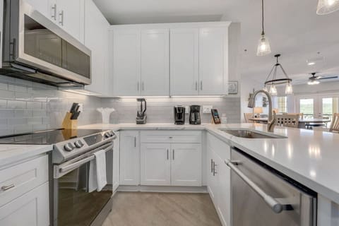 Cook with a view and plenty of space—bright chef-style kitchen with a large island at Lakeside Serenity in Lago Vista.