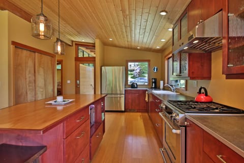 Well equipped kitchen with variety of cooking and eating utensils. 