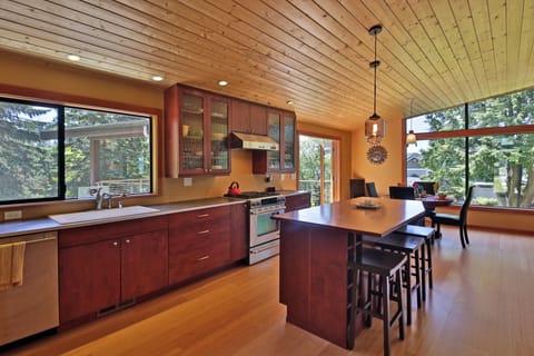 Spacious kitchen with high end stainless steel appliances.