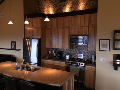 Modern Kitchen, opens up to deck with french doors to BBQ.  Easy seating for 16.