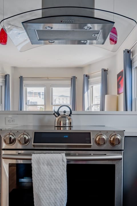 Full kitchen with stove, oven, full fridge and all the essential cookware and bakeware