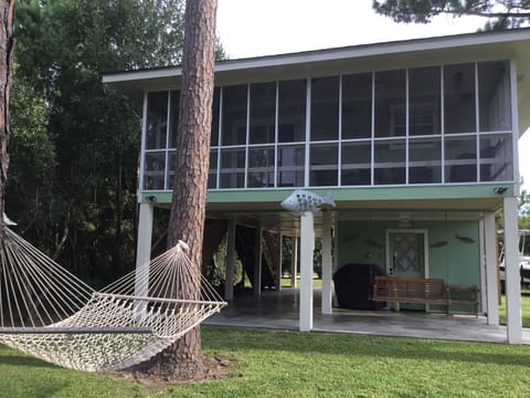 screened in porch facing bayou