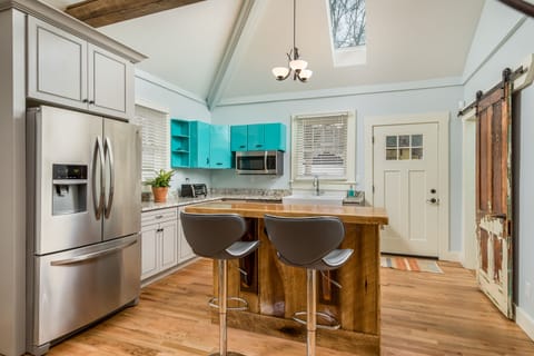 The Kitchen has Stainless Steel Appliances and is Stocked with Cooking Basics