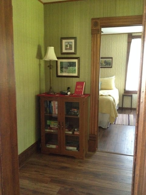 Hallway view into 1st floor Queen BR with attached bath.Games & books to enjoy!