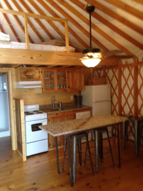 Full kitchen with stove, refrigerator, microwave and dishwasher.