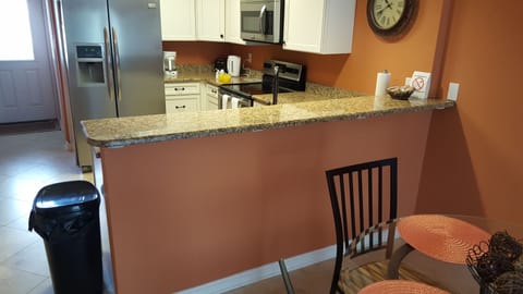Kitchen with Granite and SS aplliances fully equipped. 