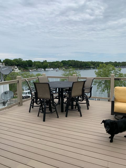 Deck overlooking the marina with chat (balcony/counter) height table