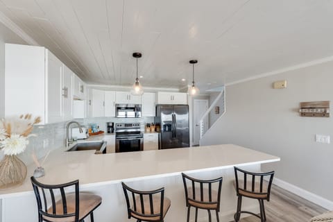 Kitchen with large bar for eating