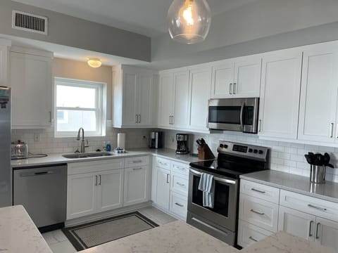 Kitchen with stainless steel appliances Oceanview 302, Isle of Palms, SC | IOP Escapes