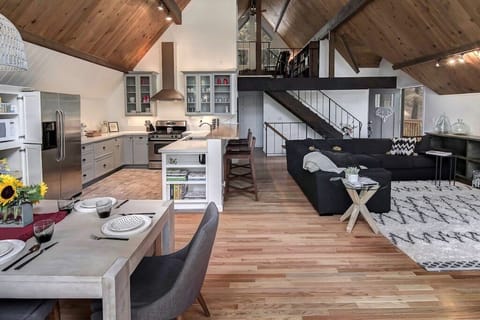 Great Room with stairs leading up to the loft rooms and down to the woodroom.