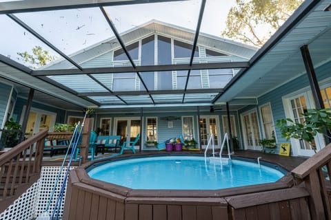 Heated pool in center of downstairs family living.