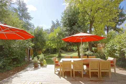 The outside deck, an oasis with table for 10, chaise loungers, and hammock.