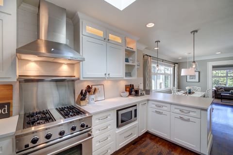 Professional gas range and hood lets you cook for family and friends in style. 