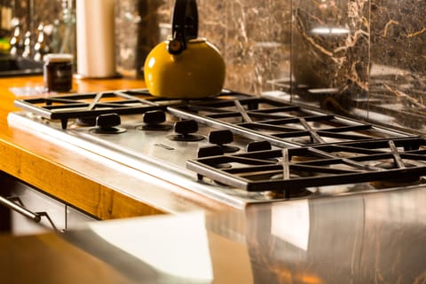 Commercial-grade, 6 burner gas range. Create a feast and share a meal, here!