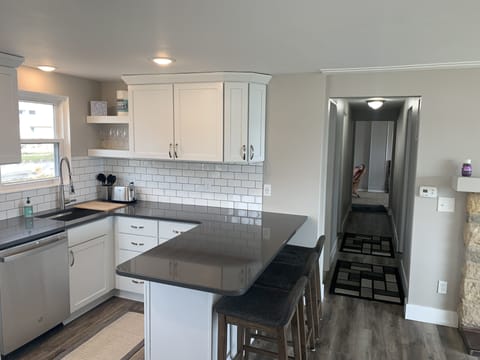 Kitchen with 3 counter height stools.  