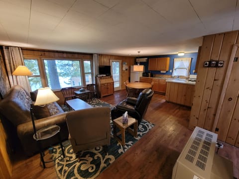 Living room area with 2 recliners and a futon couch