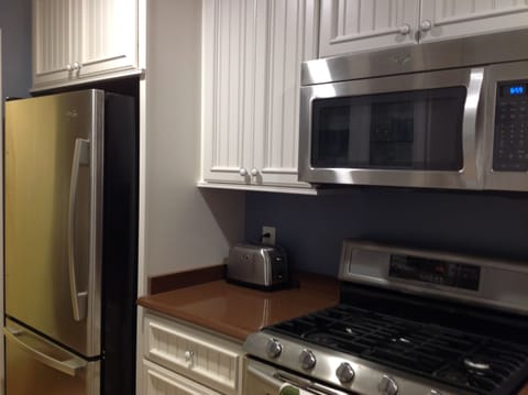 Brand new, high-end appliances with double-oven gas stove, microwave, ice-maker