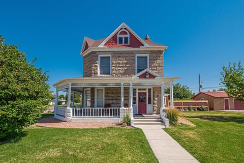 A stunning exterior with classic details and beautiful landscaping, creating a cozy and inviting atmosphere.