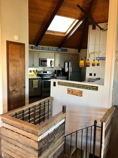 Spiral stairs lead to Bedroom level of house